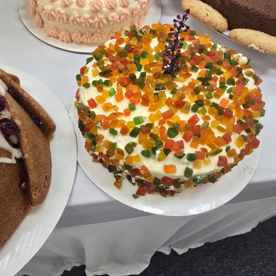 Cake topped with colorful candied fruit